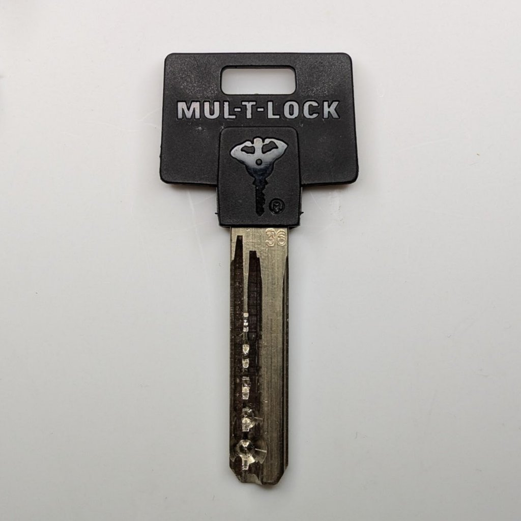 Cut Mul-T-Lock Key + Matching Key Pins